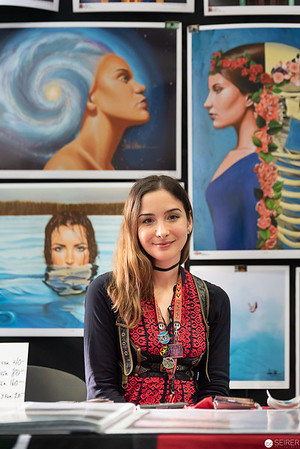 <p><a href="https://galleries.seirer-photography.com">seirer-photography</a><br />Young Artist Seated Amid Surrealist Portrait Gallery Displaying Vibrant Artwork</p><p><a href="https://galleries.seirer-photography.com/Events/2019/VIECC/Vienna-ComicCon-2019/i-tR4RRJm" title="Young Artist Seated Amid Surrealist Portrait Gallery Displaying Vibrant Artwork"><img src="https://galleries.seirer-photography.com/Events/2019/VIECC/Vienna-ComicCon-2019/i-tR4RRJm/0/LnHWB5zqRS9BvjnM5HWGdQCMqhvWCckBrt9k7pjrL/Th/20191123_144644-viecc_9841-Th.jpg" width="150" height="150" alt="Young Artist Seated Amid Surrealist Portrait Gallery Displaying Vibrant Artwork" title="Young Artist Seated Amid Surrealist Portrait Gallery Displaying Vibrant Artwork" style="border: 1px solid #000000;" /></a></p>