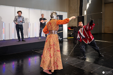 <p><a href="https://galleries.seirer-photography.com">seirer-photography</a><br />Historical Fencing Demonstration at Vienna ComicCon 2024 Cosplay Stage</p><p><a href="https://galleries.seirer-photography.com/Events/2024/VIECC/TheBestPhotos/i-8wq5Xz9" title="Historical Fencing Demonstration at Vienna ComicCon 2024 Cosplay Stage"><img src="https://galleries.seirer-photography.com/Events/2024/VIECC/TheBestPhotos/i-8wq5Xz9/0/MkBs3qdpMTcQBx95bXCnFBp4rbVkggCTRckWfL2WZ/Th/20241123_133226_viecc_2368-Th.jpg" width="150" height="150" alt="Historical Fencing Demonstration at Vienna ComicCon 2024 Cosplay Stage" title="Historical Fencing Demonstration at Vienna ComicCon 2024 Cosplay Stage" style="border: 1px solid #000000;" /></a></p>
