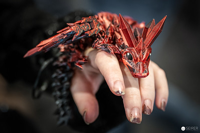 <p><a href="https://galleries.seirer-photography.com">seirer-photography</a><br />Intricate Red Dragon Ring Sculpture at Vienna ComicCon 2024</p><p><a href="https://galleries.seirer-photography.com/Events/2024/VIECC/TheBestPhotos/i-CCDrBRQ" title="Intricate Red Dragon Ring Sculpture at Vienna ComicCon 2024"><img src="https://galleries.seirer-photography.com/Events/2024/VIECC/TheBestPhotos/i-CCDrBRQ/0/NQLBKFNNNb3xbJdK4fjSsgt9t847HtCGnn4qRpskv/Th/20241123_115309_viecc_1917-Th.jpg" width="150" height="150" alt="Intricate Red Dragon Ring Sculpture at Vienna ComicCon 2024" title="Intricate Red Dragon Ring Sculpture at Vienna ComicCon 2024" style="border: 1px solid #000000;" /></a></p>