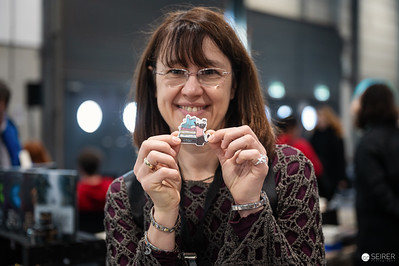<p><a href="https://galleries.seirer-photography.com">seirer-photography</a><br />Attendee Smiling with Small Collectible at Vienna ComicCon 2024</p><p><a href="https://galleries.seirer-photography.com/Events/2024/VIECC/TheBestPhotos/i-WCJg58V" title="Attendee Smiling with Small Collectible at Vienna ComicCon 2024"><img src="https://galleries.seirer-photography.com/Events/2024/VIECC/TheBestPhotos/i-WCJg58V/0/Lt3kvHPLpRkpWNpGGLKQswDhfwRBcfxBtxSZg78br/Th/20241123_125452_viecc_2108-Th.jpg" width="150" height="150" alt="Attendee Smiling with Small Collectible at Vienna ComicCon 2024" title="Attendee Smiling with Small Collectible at Vienna ComicCon 2024" style="border: 1px solid #000000;" /></a></p>