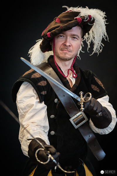 <p><a href="https://galleries.seirer-photography.com">seirer-photography</a><br />Costumed Performer with Sword at Vienna ComicCon 2024 Dramatic Portrait</p><p><a href="https://galleries.seirer-photography.com/Events/2024/VIECC/TheBestPhotos/i-Zd2ssmB" title="Costumed Performer with Sword at Vienna ComicCon 2024 Dramatic Portrait"><img src="https://galleries.seirer-photography.com/Events/2024/VIECC/TheBestPhotos/i-Zd2ssmB/0/KhZHhC75Tp3ppv32LLdbPnWjx825DjdN9fx3Dq4Jw/Th/20241123_133757_viecc_-Th.jpg" width="150" height="150" alt="Costumed Performer with Sword at Vienna ComicCon 2024 Dramatic Portrait" title="Costumed Performer with Sword at Vienna ComicCon 2024 Dramatic Portrait" style="border: 1px solid #000000;" /></a></p>