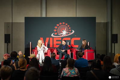 <p><a href="https://galleries.seirer-photography.com">seirer-photography</a><br />VIECC 2024 Panel Discussion with Guests on Red Chairs</p><p><a href="https://galleries.seirer-photography.com/Events/2024/VIECC/TheBestPhotos/i-bb5ttq4" title="VIECC 2024 Panel Discussion with Guests on Red Chairs"><img src="https://galleries.seirer-photography.com/Events/2024/VIECC/TheBestPhotos/i-bb5ttq4/0/KPj5tVj3DqtFcDq4qr8VbtHqN8dvQmFmsJ79kPmkz/Th/20241123_121702_viecc_1994-Th.jpg" width="150" height="150" alt="VIECC 2024 Panel Discussion with Guests on Red Chairs" title="VIECC 2024 Panel Discussion with Guests on Red Chairs" style="border: 1px solid #000000;" /></a></p>