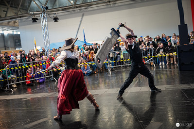 <p><a href="https://galleries.seirer-photography.com">seirer-photography</a><br />Cosplayers Engage in Dramatic Sword Fight at Vienna ComicCon 2024</p><p><a href="https://galleries.seirer-photography.com/Events/2024/VIECC/TheBestPhotos/i-km7PKDz" title="Cosplayers Engage in Dramatic Sword Fight at Vienna ComicCon 2024"><img src="https://galleries.seirer-photography.com/Events/2024/VIECC/TheBestPhotos/i-km7PKDz/0/MrjR4NtvswDrLR5NxpCsdWsQZBJ3pb4M2srTdFHbf/Th/20241123_145818_viecc_3305-Th.jpg" width="150" height="150" alt="Cosplayers Engage in Dramatic Sword Fight at Vienna ComicCon 2024" title="Cosplayers Engage in Dramatic Sword Fight at Vienna ComicCon 2024" style="border: 1px solid #000000;" /></a></p>