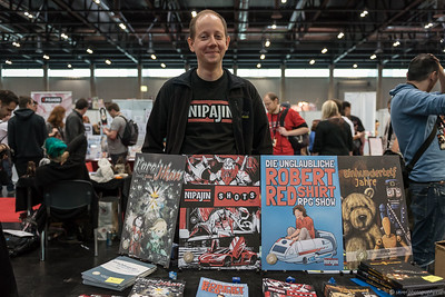 <p><a href="https://galleries.seirer-photography.com">seirer-photography</a><br />Artist at VIECC 2015 Comic Convention Displaying Graphic Novel Collection</p><p><a href="https://galleries.seirer-photography.com/Events/ViennaComicCon2015/Vienna-ComicCon/i-G2CS62B" title="Artist at VIECC 2015 Comic Convention Displaying Graphic Novel Collection"><img src="https://galleries.seirer-photography.com/Events/ViennaComicCon2015/Vienna-ComicCon/i-G2CS62B/0/M92BgJDp9TRwdbjbwHSTXjGcXp5JWQ4gQ74Xzrmks/Th/2015-11-21-12-12-55_viecc_7149-Th.jpg" width="150" height="150" alt="Artist at VIECC 2015 Comic Convention Displaying Graphic Novel Collection" title="Artist at VIECC 2015 Comic Convention Displaying Graphic Novel Collection" style="border: 1px solid #000000;" /></a></p>